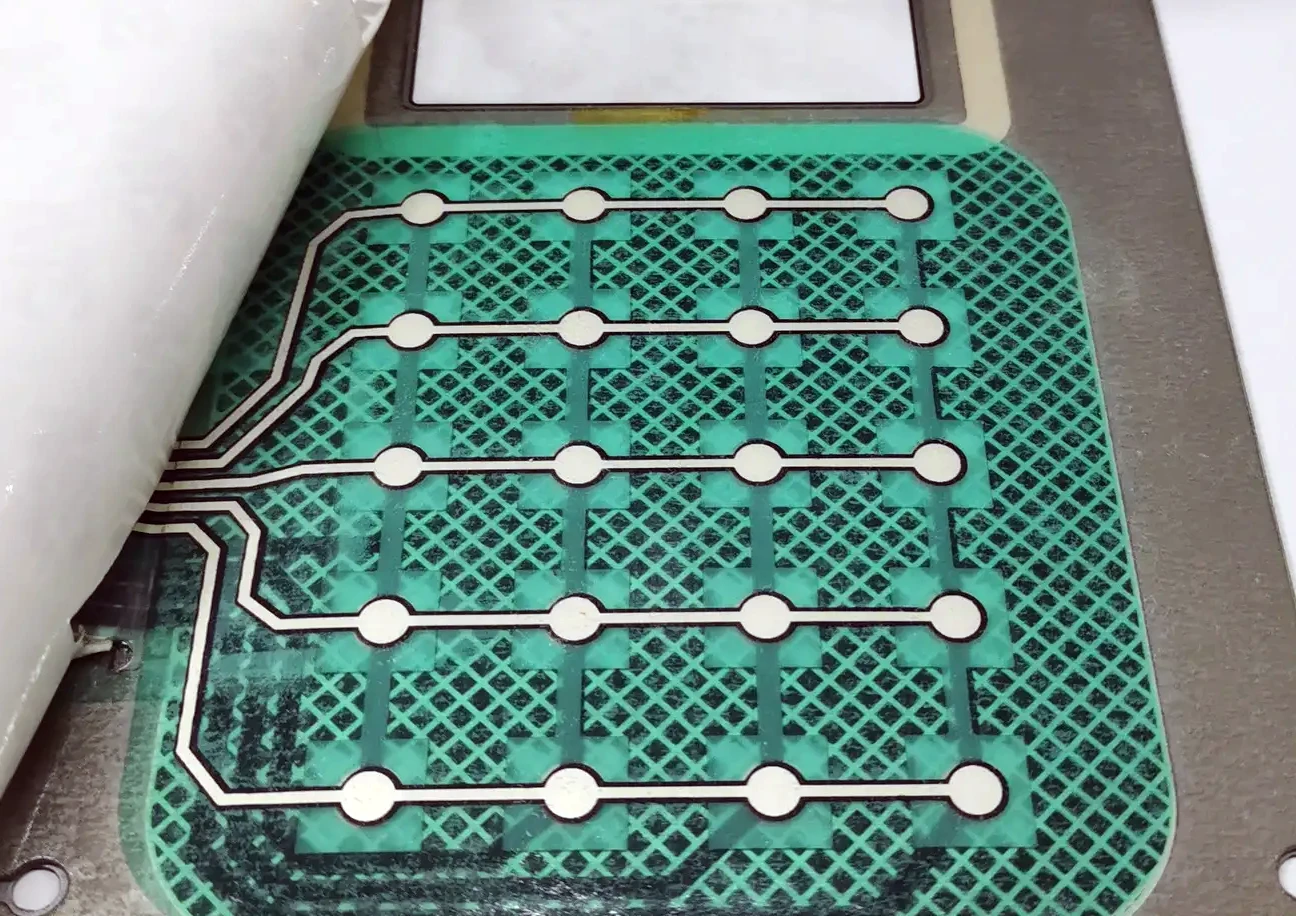 This is the solution for shielding membrane switches by printing silver paste on a grid.